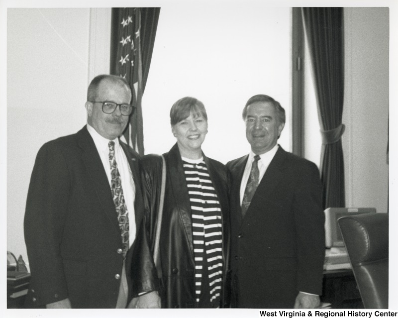 L-R: Mike and Pat Burdiss, Representative Nick J. Rahall (D-W.Va.) The three pose for a photograph inside.