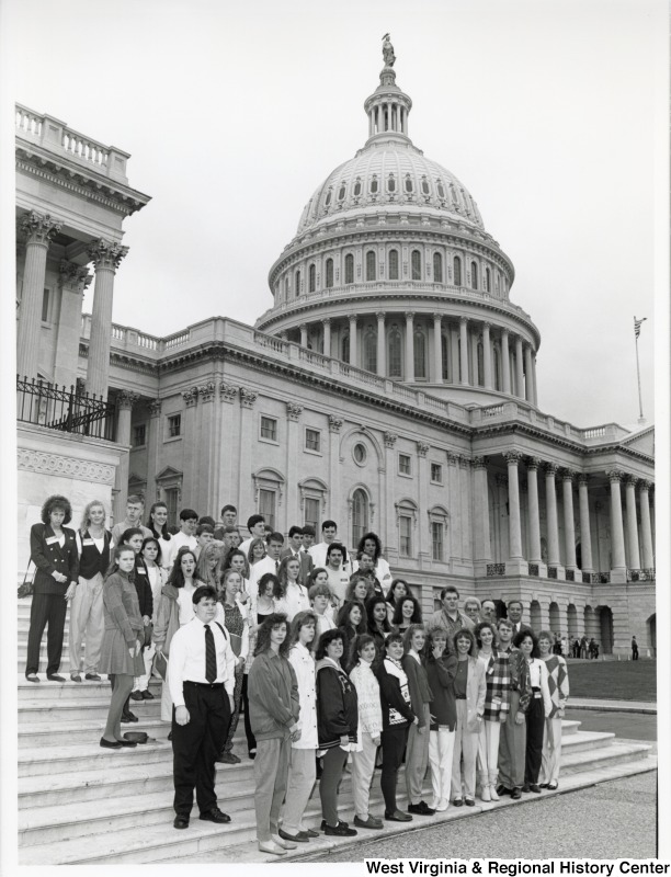 On the right of the group, Representative Nick J. Rahall (D-W.Va.) stands for a photo with a school group from Huntington East outside the United States Capitol building.