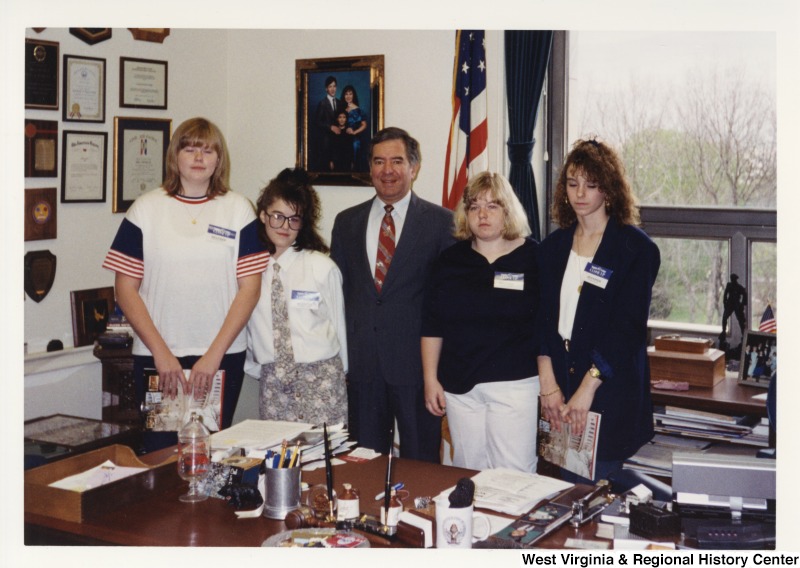 In the center, Representative Nick J. Rahall (D-W.Va.) stands for a photograph with four unidentified students from Logan County, WV.