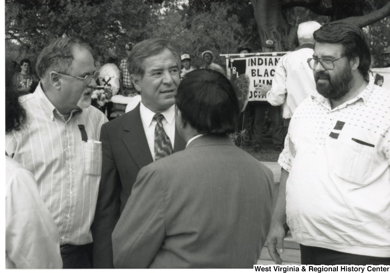 Congressman Nick Rahall (D-WV) speaking with an unidentified group of people at a Black Lung Association rally at the United States Capitol Complex.