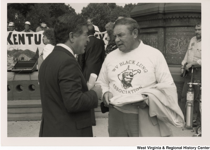 Congressman Nick Rahall (D-WV) speaking with an unidentified man from West Virginia at a Black Lung Association rally at the United States Capitol Complex.