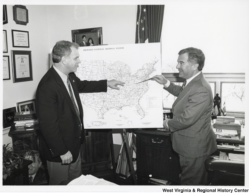 Congressman Nick Rahall (D-WV) and former Governor and Congressman Ted Strickland (D-WV) looking at a map of the United States.