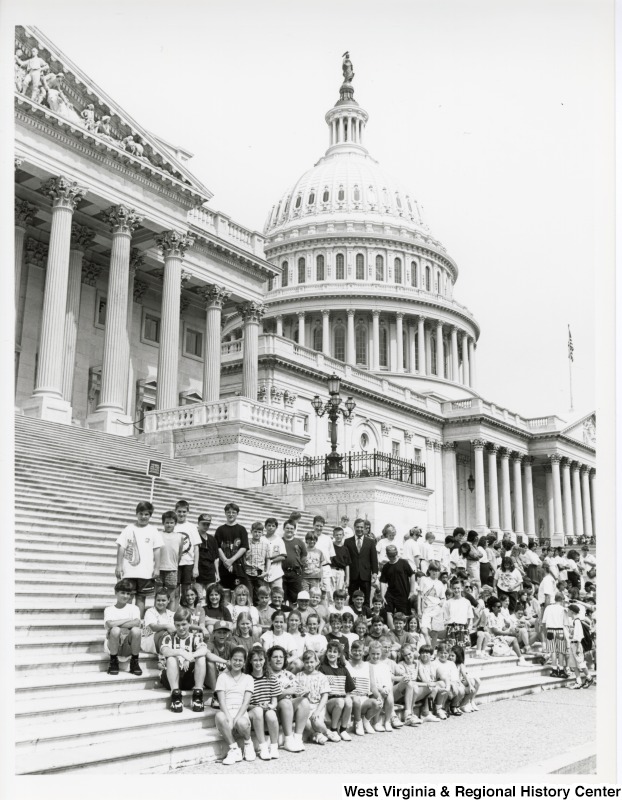 Photograph of Congressman Nick Rahall (D-WV) with unidentified Ona Elementary School students at the United States Capitol building.