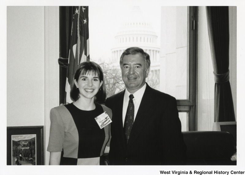 On the right, Representative Nick J. Rahall (D-W.Va.) stands for a photograph in his office with Sarah Lewis.