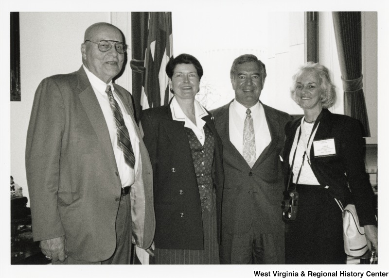 L-R: An unidentified man, an unidentified woman, Representative Nick J. Rahall (D-W.Va.), Linda Curry of the Logan County, West Virginia Community Action AgencyThe four stand together for a photograph in Congressman Rahall's office.