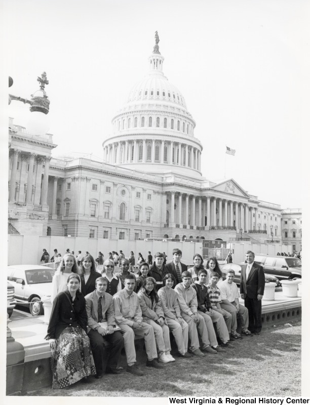 On the far right, Representative Nick J. Rahall (D-W.Va.) stands with a group of high school students for a photograph outside the United States Capitol building.