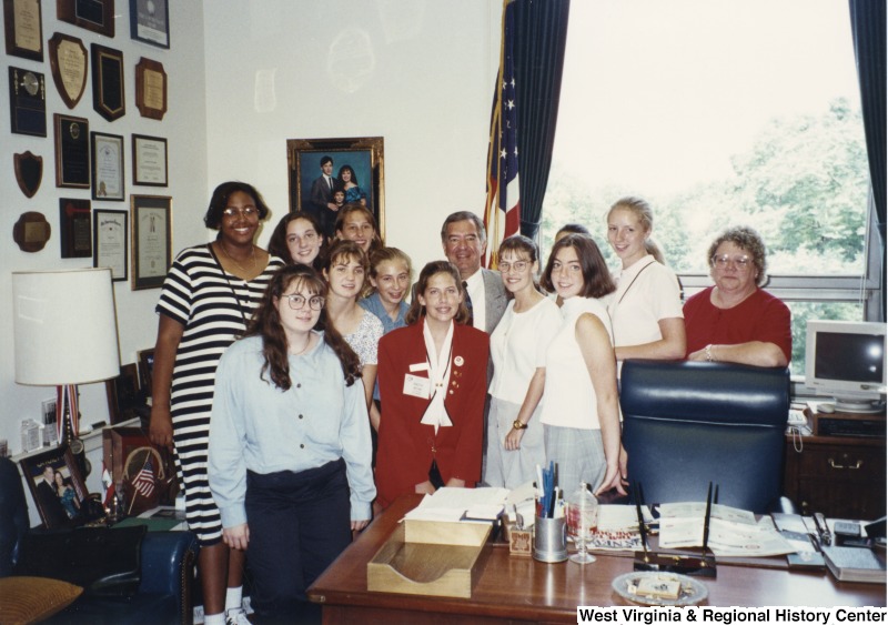 Representative Nick J. Rahall (D-W.Va.) stand for a photograph with a group of unidentified women from the Future Homemakers of America.