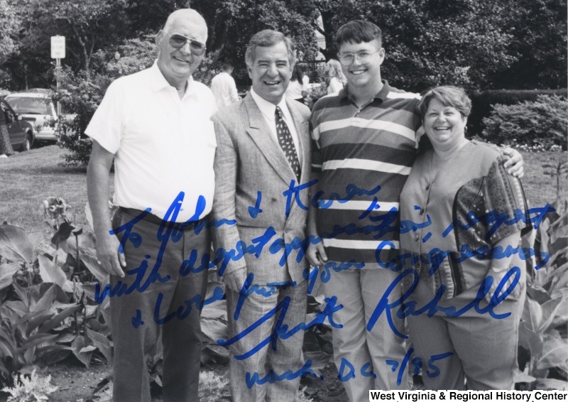L-R: John Jones, Representative Nick J. Rahall (D-W.Va.), unidentified man, Karen JonesThese four individuals stand together for a photograph. The image is signed and reads, "To John + Karen, with deepest appreciation, respect + love from your Congressman Nick Rahall Wash. D.C. 7/95."