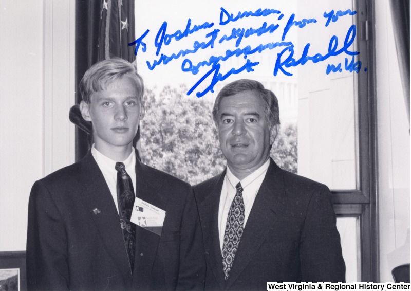 Joshua Duncan, a student from Wayne County, stands for a photograph with Representative Nick J. Rahall (D-W.Va.). The photograph is signed and reads, "To Joshua Duncan, warmest regards from your congressman Nick Rahall W.Va."