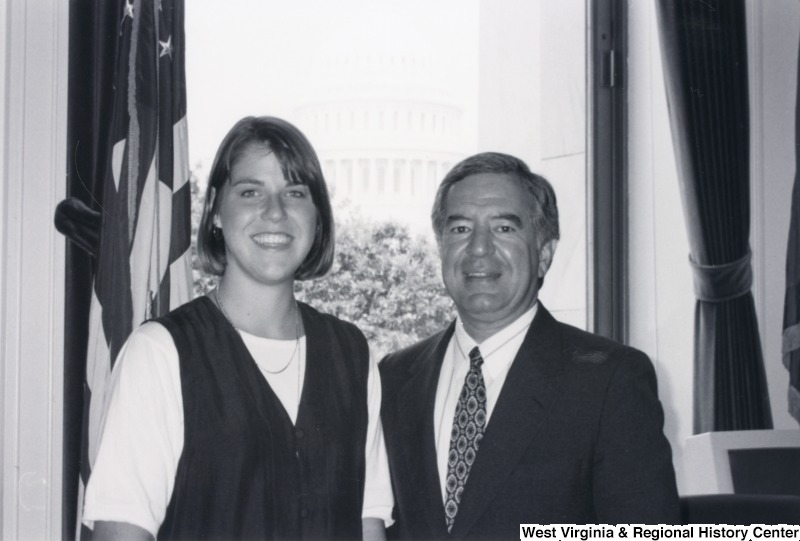 On the right, Representative Nick J. Rahall (D-W.Va.) stands for a photograph with an unidentified woman.