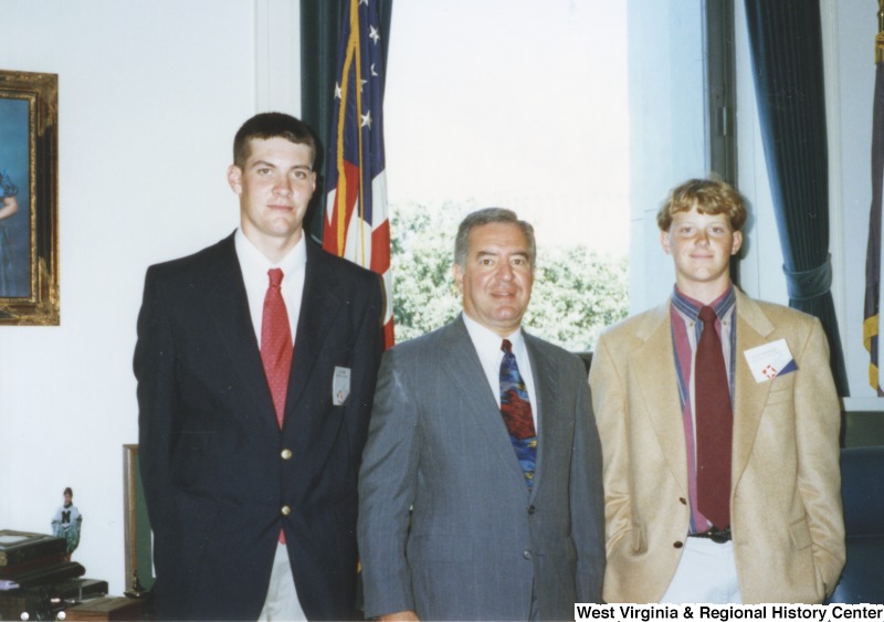 Representative Nick J. Rahall (D-W.Va.) stands between two unidentified men of the Congressional Youth Leadership.