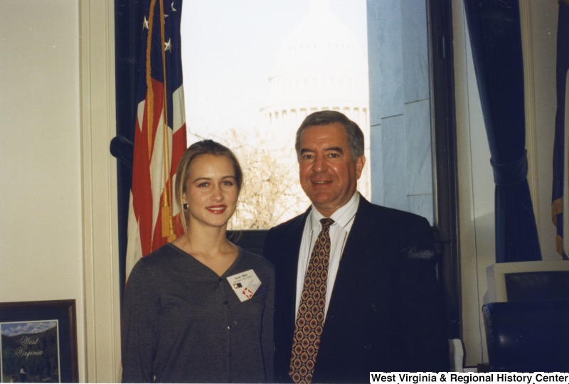 On the right, Representative Nick J. Rahall (D-W.Va.) stands with an unidentified woman.