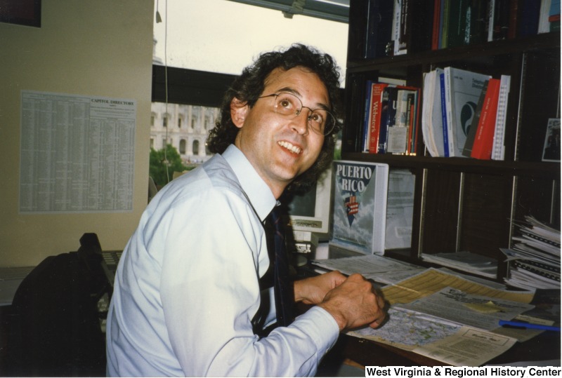 An unidentified man at a desk.
