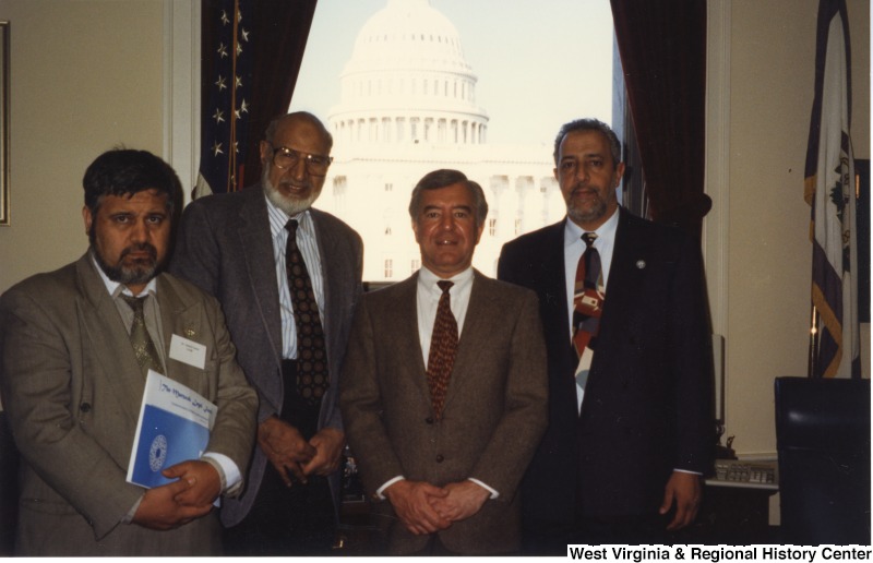 From left to right; Two unidentified men, Congressman Nick Rahall (D-WV), and American Muslim Council founder Abdul Rahman al-Amoudi in Rahall's D.C. office.