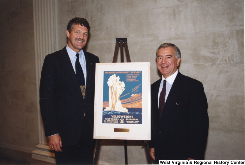 Congressman Nick Rahall (D-WV) with National Parks Conservation Association President Tom Kiernan in front of a Yellowstone National Park poster at a Friends of National Parks event.