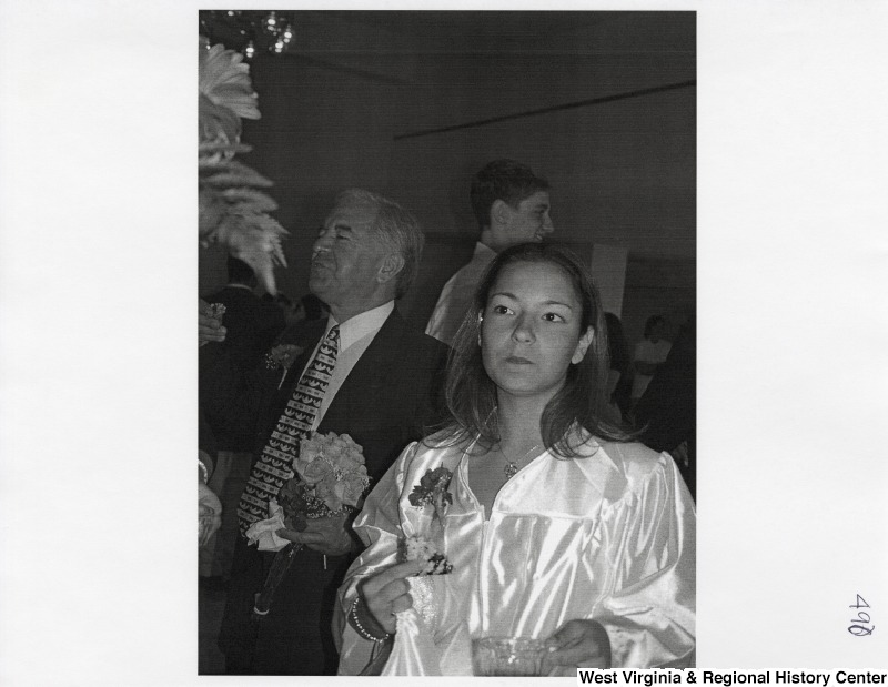 Representative Nick J. Rahall (D-W.Va.) and Suzanne Rahall stand and talk at a party.