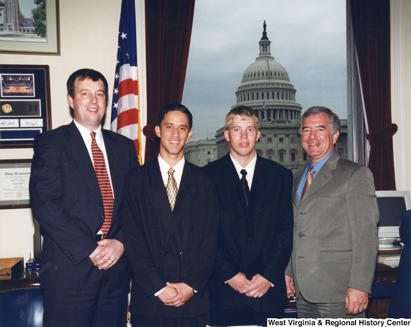 On the far right, Representative Nick J. Rahall (D-W.Va.) stands for a photograph with three unidentified men in his office.