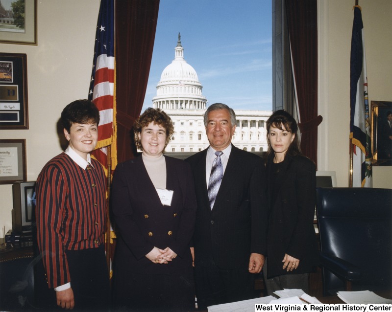 L-R: unidentified woman, Jo Ann Betler, Representative Nick J. Rahall (D-W.Va.), unidentified womanThe four people stand for a photograph in Congressman Rahall's office.