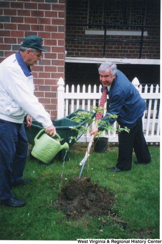 Congressman Nick Rahall (D-WV) and Mr. Jack Feller plating a tree at the Mullens Dogwood Festival.