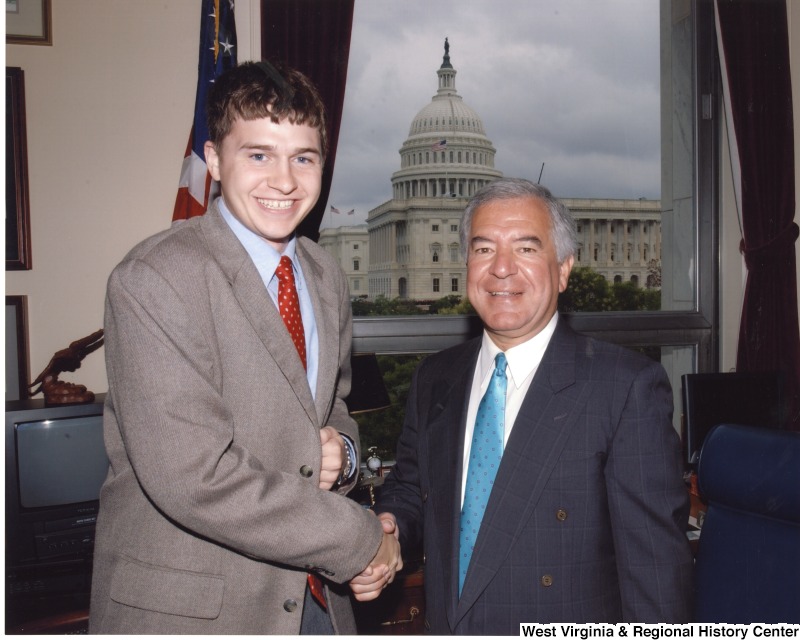 Congressman Nick Rahall (D-WV) with an unidentified male intern in is D.C. office.