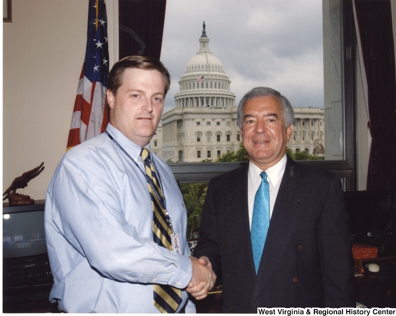 On the right, Congressman Nick Rahall (D-WV) stands with an unidentified man who was an intern.