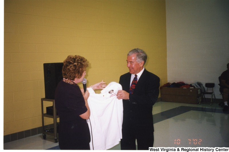Congressman Nick Rahall (D-WV) accepting a shirt from an an unidentified woman at Barboursville Elementary School.