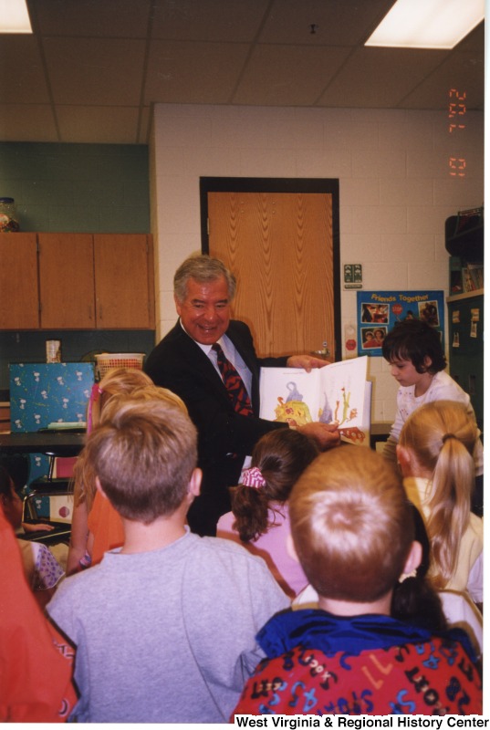 Congressman Nick Rahall (D-WV) reading to group of unidentified students at Barboursville Elementary School.