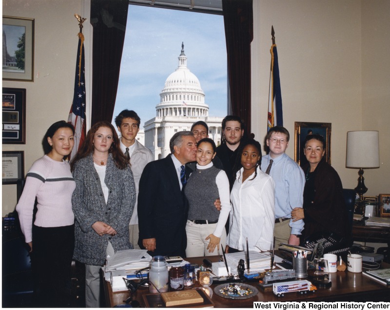 Congressman Nick Rahall (D-WV) with his daughter, Suzanne, and a group of unidentified young people in his D.C. office.
