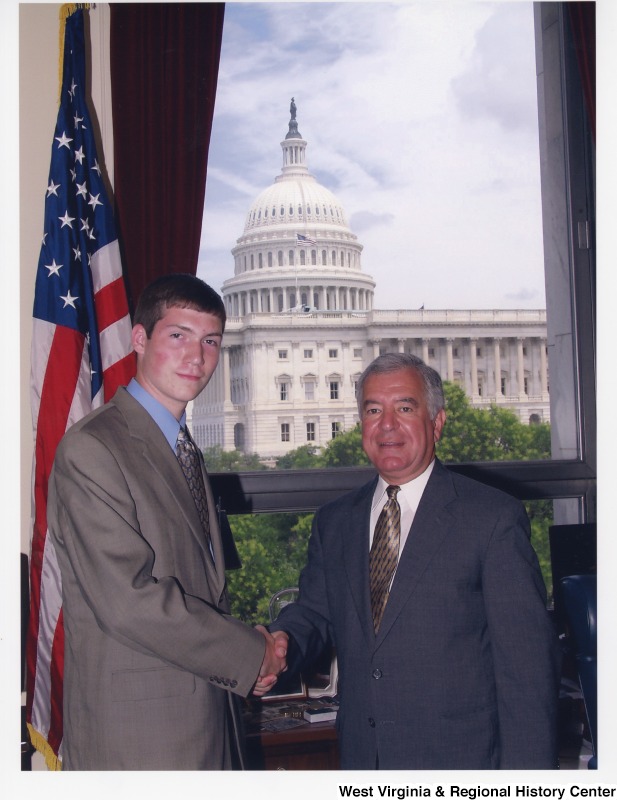Congressman Rahall (D-WV) with an unidentified young man in his D.C. office.