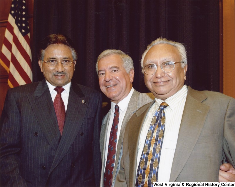 Congressman Nick Rahall (D-WV) with two unidentified men in suits.
