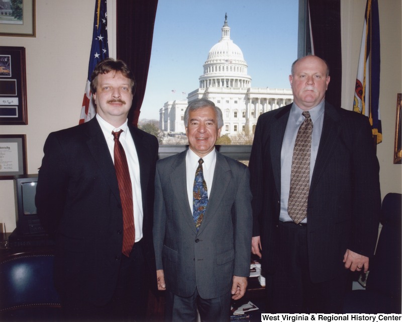 Congressman Nick Rahall (D-WV) with two unidentified men in his D.C. office.