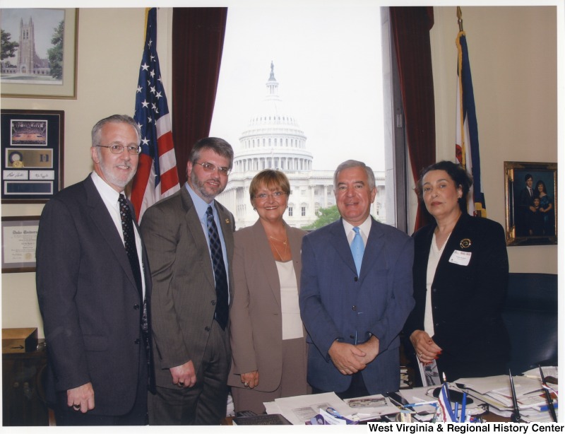 Congressman Nick Rahall (D-WV) with a group of unidentified people in his D.C. office.