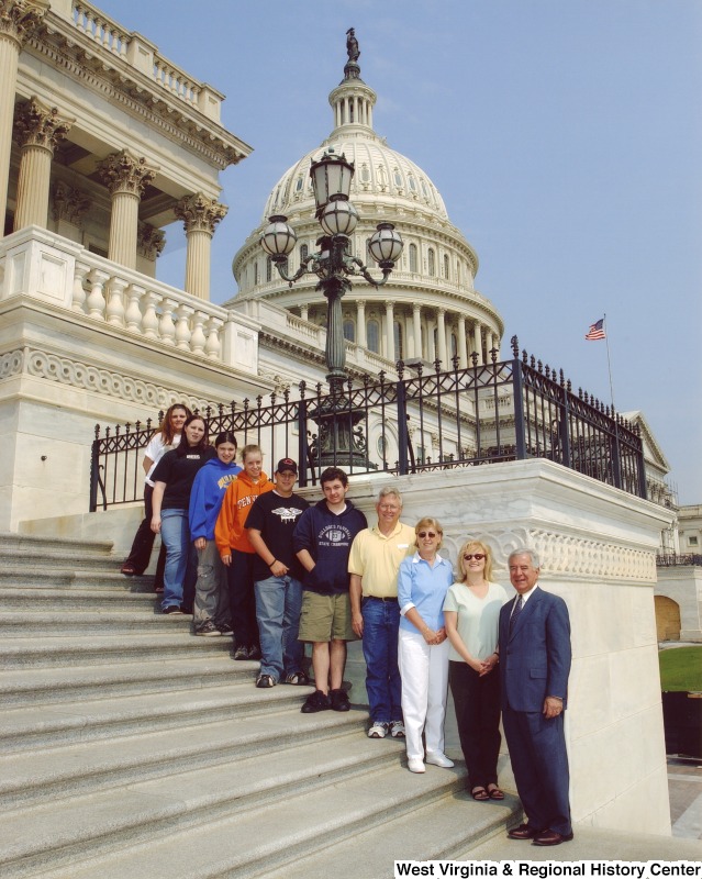 Congressman Nick Rahall (D-WV) with an unidentified group of people in front of the United States Capitol building.