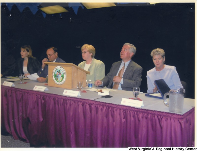 Congressman Nick Rahall (D-WV) on stage with a group of unidentified people at Concord University.