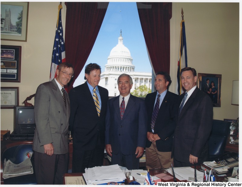 Congressman Nick Rahall (D-WV) with a group of unidentified men in his D.C. office.