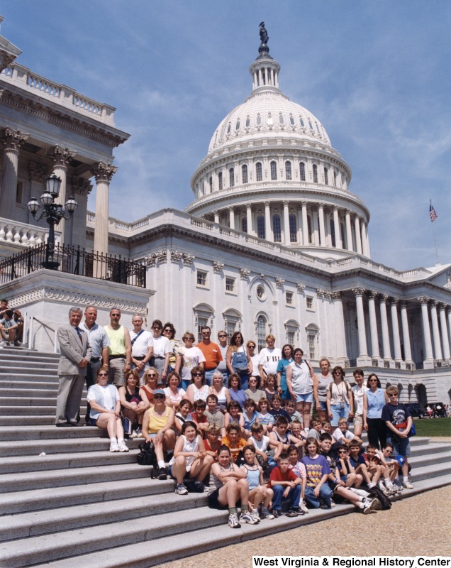 Congressman Nick Rahall (D-WV) with an unidentified group of people in front of the United States Capitol building.