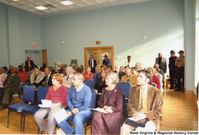 An unidentified group of people sitting at an event in Bramwell, West Virginia.