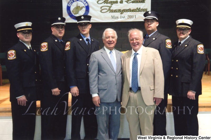 Congressman Nick Rahall (D-WV) with a group of unidentified officers and an unidentified man at the City of Logan Mayor and Council Inauguration.