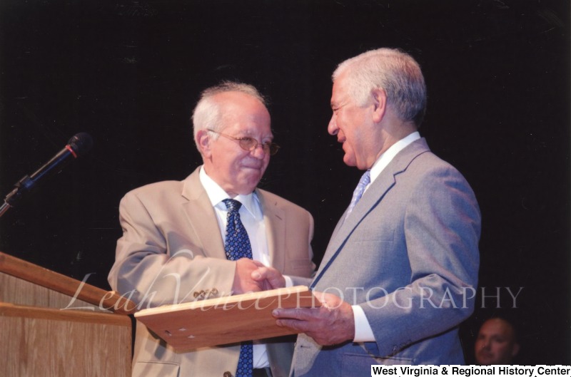 Congressman Nick Rahall (D-WV) shaking hands with an unidentified man at the City of Logan Mayor and Council Inauguration.