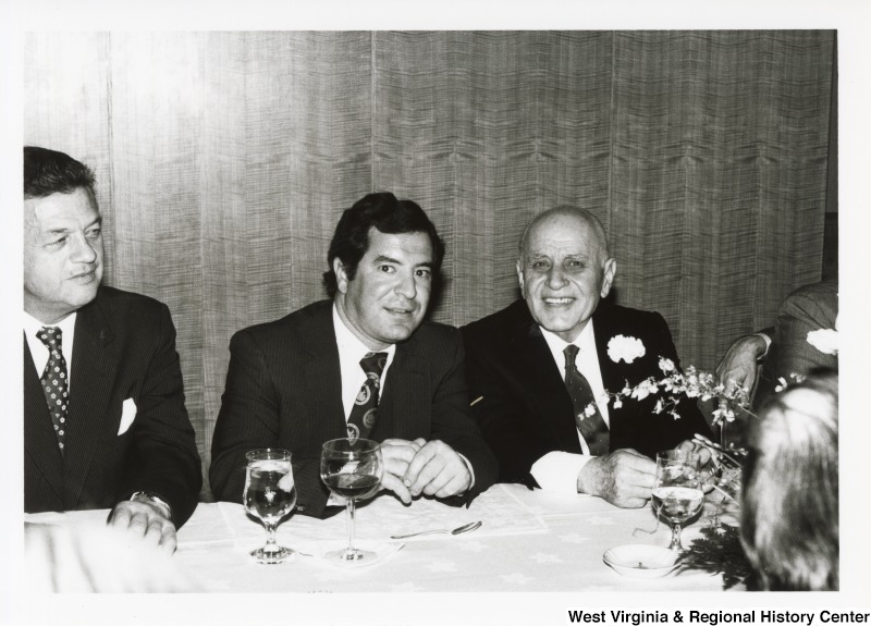 Congressman Nick Rahall (D-WV) with two unidentified men at a dinner.