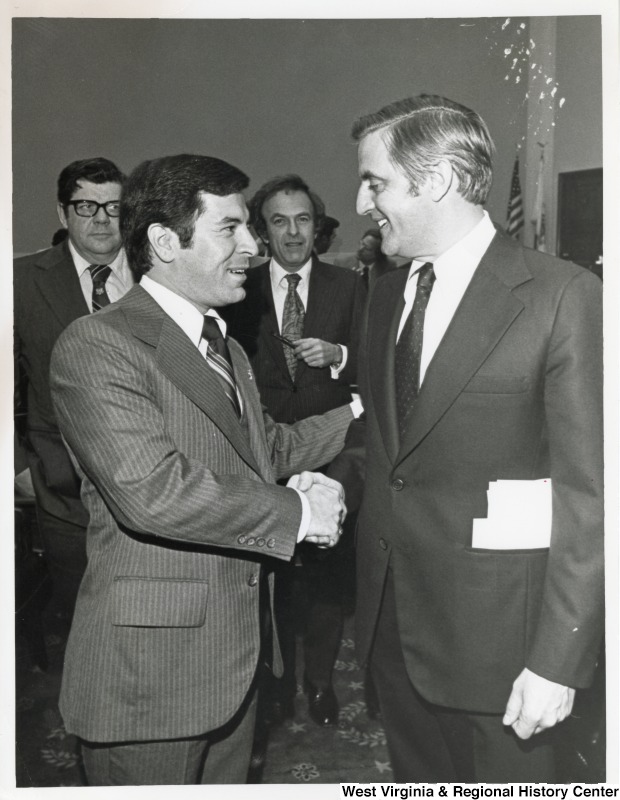 On the left, Representative Nick J. Rahall (D-W.Va.) shakes hands with Vice President Walter Mondale (D-MN).