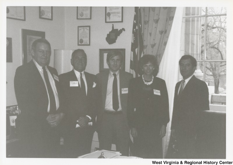 On the far right, Representative Nick J. Rahall (D-W.Va.) stands for a photograph with three unidentified men and an unidentified woman.