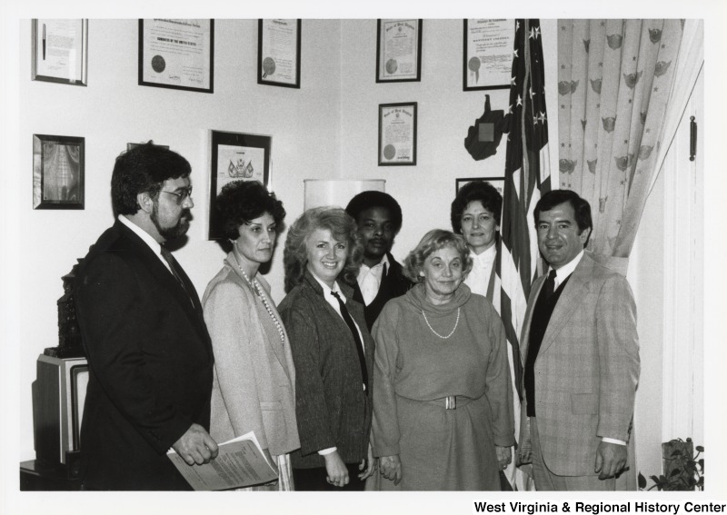 On the far right, Representative Nick J. Rahall (D-W.Va.) stands for a photograph with six unidentified people.