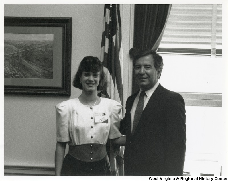 On the right, Representative Nick J. Rahall (D-W.Va.) stands for a photograph with an unidentified woman.