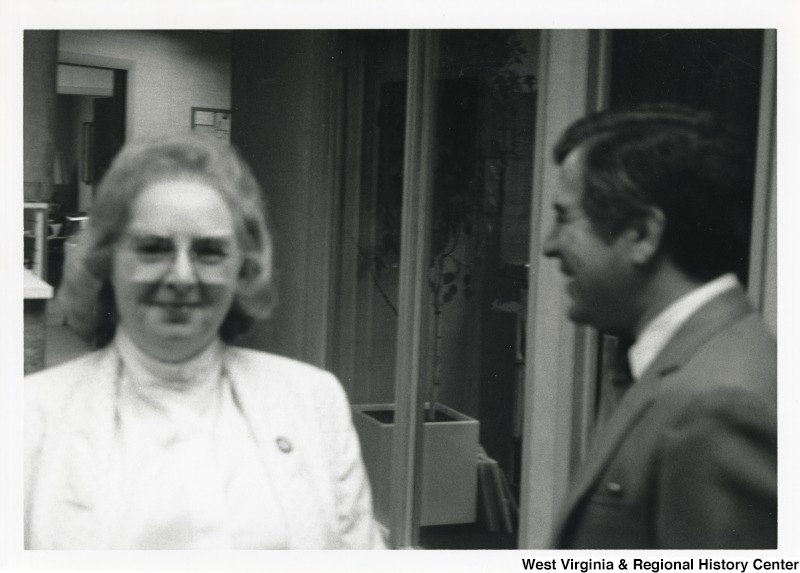 On the right, Representative Nick J. Rahall (D-W.Va.) smiles with an unidentified woman.