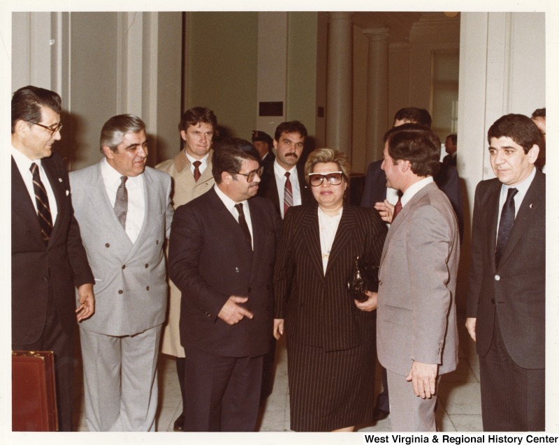 Representative Nick J. Rahall (D-W.Va.) talks with Turkish Prime Minister Turgu zal in a crowd.