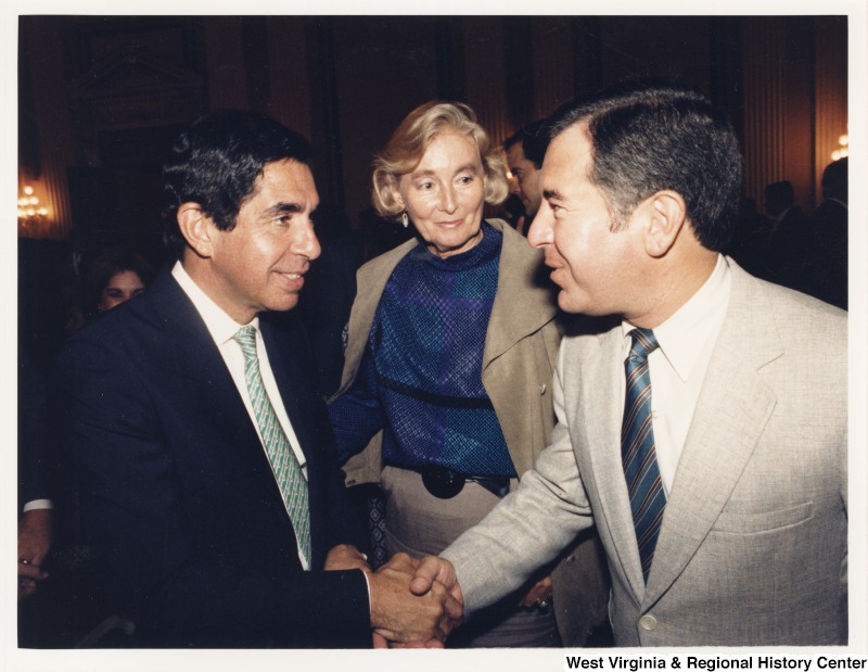 On the right, Representative Nick J. Rahall (D-W.Va.) shakes hands with Costa Rican President Oscar Arias Sanchez.