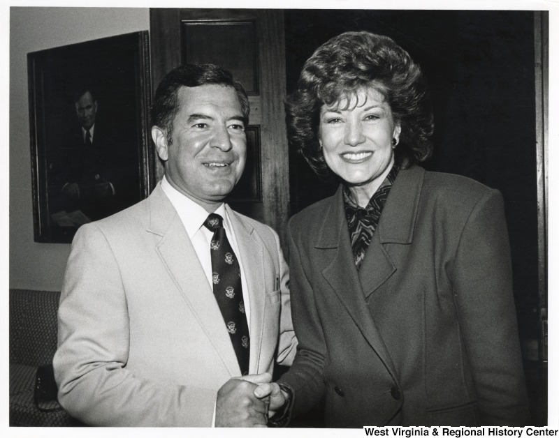 On the left, Representative Nick J. Rahall (D-W.Va.) shakes hands with Secretary of Transportation Elizabeth Dole.