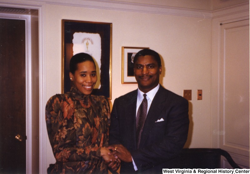 Rodney Slater stands with an unidentified woman.