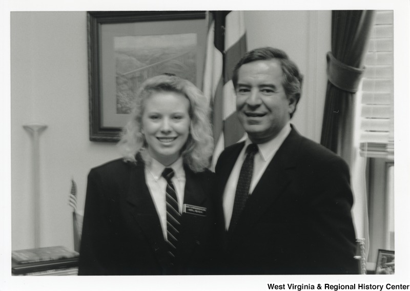 Representative Nick J. Rahall (D-W.Va.) stands for a photograph with an unidentified young woman.